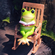 Frog Figurine Sitting on Rocking Chair Reading Book