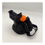 Hard style structured saddle with headless rider figurine and pumpkin accent