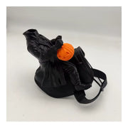 Hard style structured saddle with headless rider figurine and pumpkin accent