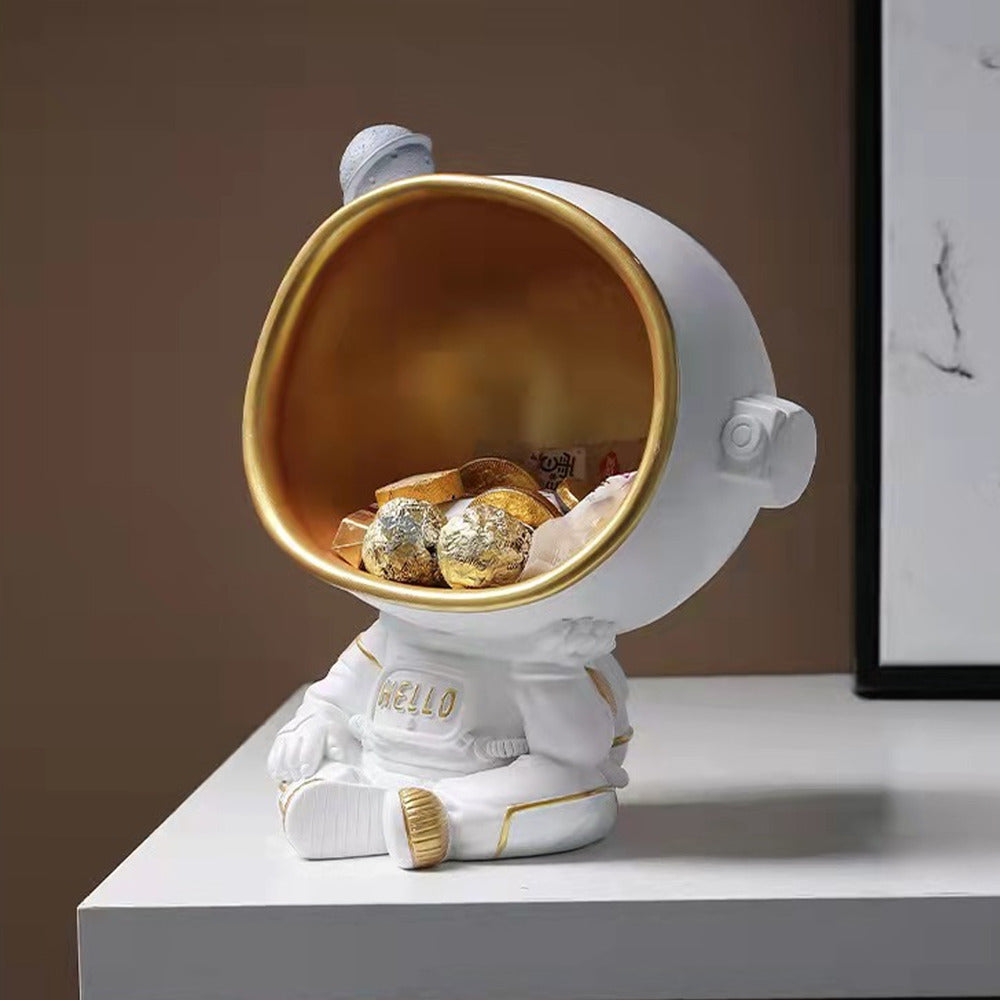 Estatua de astronauta pensante para almacenamiento