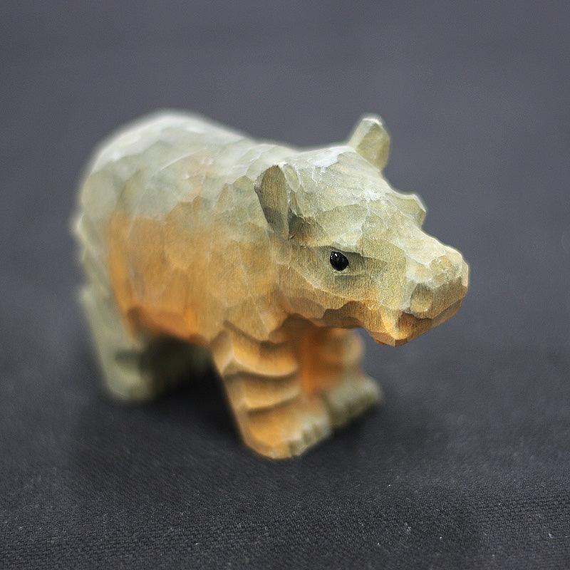 Figuritas de hipopótamo talladas a mano de madera pintada